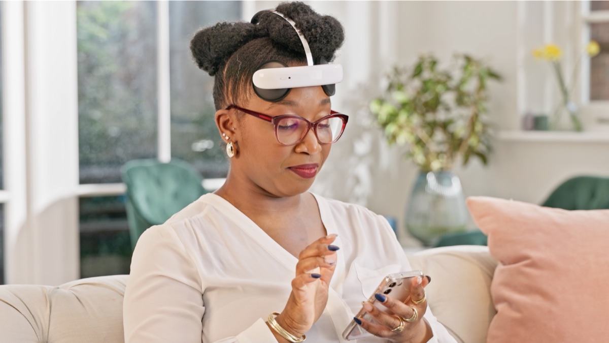Gurvinder, a Flow user, at home wearing the Flow headset